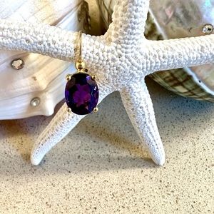 Amethyst set in 14 karat gold single earring